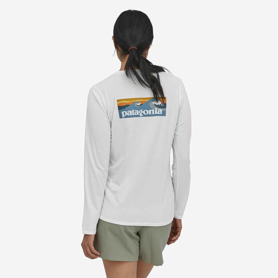 Patagonia W's Long-Sleeved Capilene® Cool Daily Graphic Shirt: Boardshort Logo Light Plume Grey - White